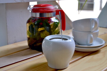 tea, sugar and cups on a table