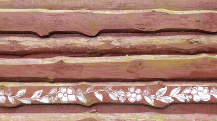 Walls from old planks painted brown, paneling overlapped each other as background. Abstract wooden background. The texture of the fence from unedged horizontal boards. Copy space, close-up.