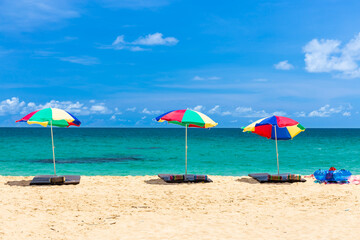 beach umbrella and ring on beach with blue sky, phuket thailand