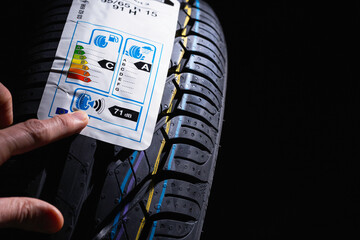 Label on tire with information about level of noise, braking distance on wet road, fuel efficiency....