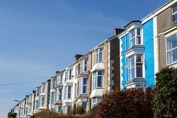 Typical Welsh Terraced Houses in UK with blue sky background. 
