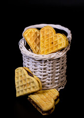 Heart cake with cocoa cream  in a basket