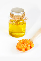 natural mint oil in a bottle and medicinal capsules