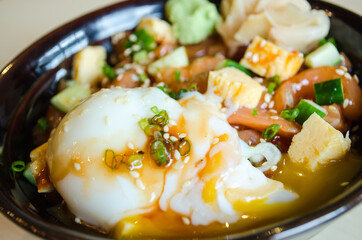 Japanese traditional dish Gyudon made from thinly sliced beef, onion, soy sauce and onsen tamago