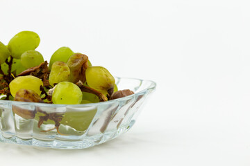 Rotten green grapes on white backgroung