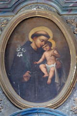 Saint Anthony of Padua holds the child Jesus, altar painting on the high altar in the parish church...