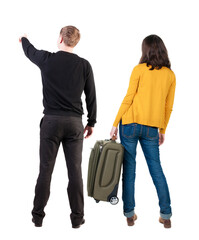 young couple in sweater traveling with suitcas.