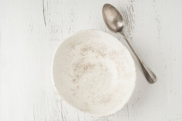 empty and clean bowl and spoon on a table