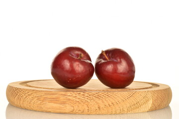 Juicy, tasty, organic red plum, close-up, on a white background.