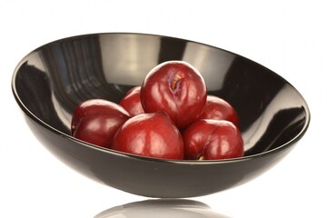 Juicy, tasty, organic red plum, close-up, on a white background.