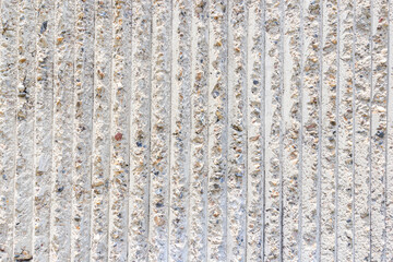 Cement wall texture with vertical pattern on day noon light for interior or exterior brick wall building and decoration texture background.