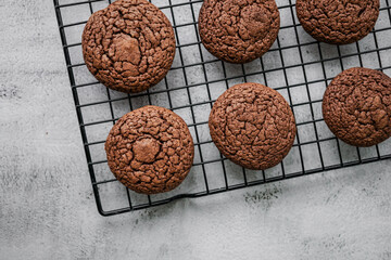 Chocolate whoopie pies on gray background with copy space.