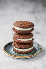 Chocolate whoopie pies on gray background with copy space.