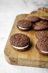 Whoopie pies on a wooden board.