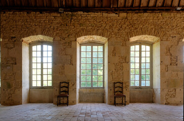 Light flooding through window at the Abbaye De Bèze, Burgundy. France - obrazy, fototapety, plakaty