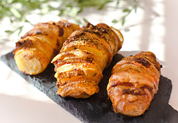 Homemade Hasselback Potatoes with bacon and cheese