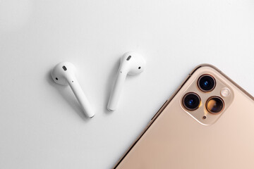 white wireless headphones on a background