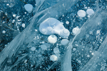 Ice cracks and frozen bubbles of gas in Baikal lake