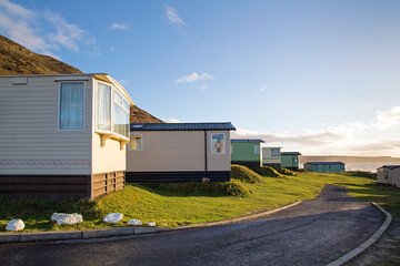 Static caravan holiday homes at Llangennith on the Gower Peninsular in winter which is out of season, the caravans are closed up until spring.