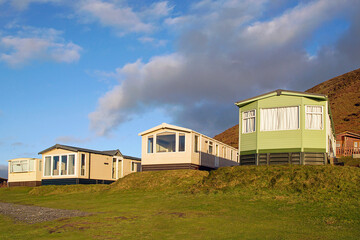 Static caravan holiday homes at Llangennith on the Gower Peninsular in winter which is out of season, the caravans are closed up until spring.