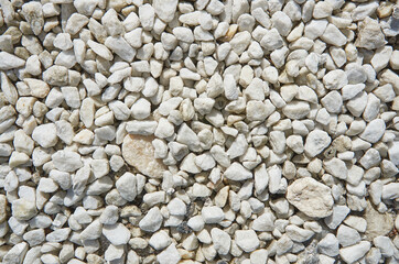 Background of light stone, chippings stone closeup. Stone texture.