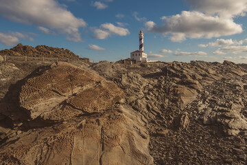 lighthouse at the morning in a sunny winter day in menorca, spain