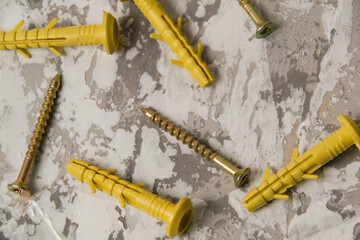 Yellow dowels on white-gray putty background with place for text insertion