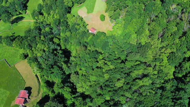 Aerial view with a drone of the countryside landscape, meadows and trees in Solana in the Miera Valley, Valles Pasiegos, Alto As&oacute;n, Cantabria, Spain, Europe