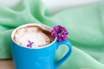 Cappuccino coffee in beautiful blue cups. Spring mood with a Cup of coffee.