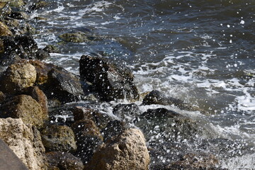 water splashing against rocks