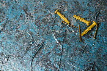 lot of dowels on the background of decorative putty blue