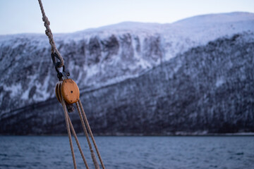 Naklejka premium Sailing ropes in the foreground of a Norwegian fjord in the evening