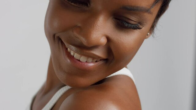 Closeup of mixed race black woman with short haircut smiling Smile is a point of attention