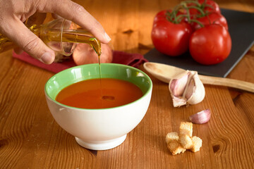 Obraz na płótnie Canvas Tomato Gazpacho Cook Onion Garlic Spoon Toasted Bread selective focus hand oil
