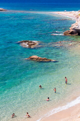 Obraz premium Sandy beach and crystal turquoise colors in a shore in Attica, near Athens, Greece.