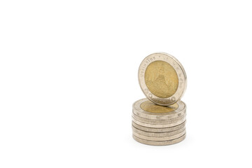 10 Baht coins; The Thai silver and gold color inside the coin, with temple sign inside of it on white background. Clipping Path.