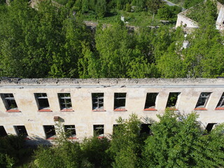 Fototapeta na wymiar Amazing Old Soviet Building with Trees inside
