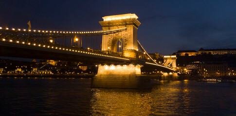 Hungarian landmarks, Chain Bridge, Royal Palace and Danube river in Budapest at sunset.