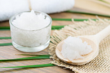 Coconut oil, unrefined, cold pressed on a wooden spoon. Virgin oil, natural body lotion