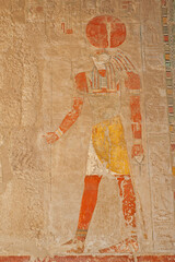 Hieroglyphic carvings on an ancient egyptian temple wall