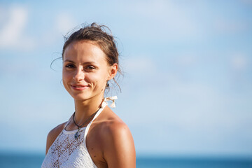 Fototapeta na wymiar portrait of a beautiful girl in a white swimsuit