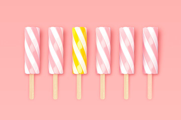 sweet twisted marshmallow or ice cream on wooden stick isolated on pink glamour background - exception outstand