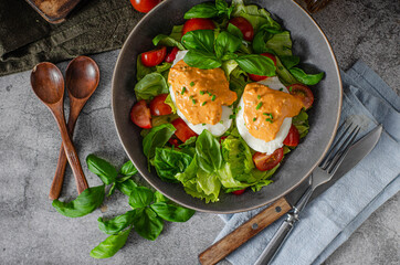 Organic egg benedict with salad