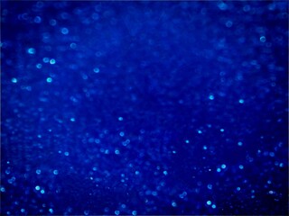 Abstract blue background with glitters.  Bokeh blue background.  Silver bokeh background.  Blank...