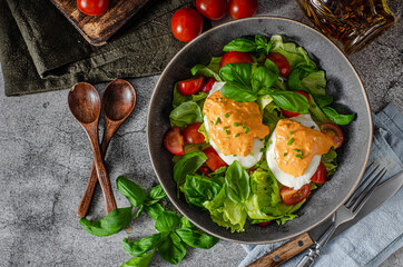 Organic egg benedict with salad