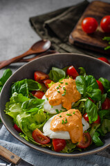 Organic egg benedict with salad
