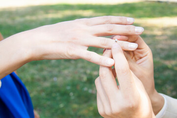 Engagement outdoors. Hands close up.