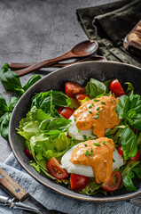Organic egg benedict with salad