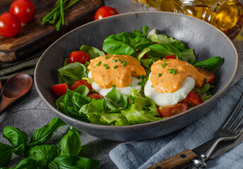 Organic egg benedict with salad
