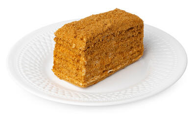 Piece of honey cake isolated on white